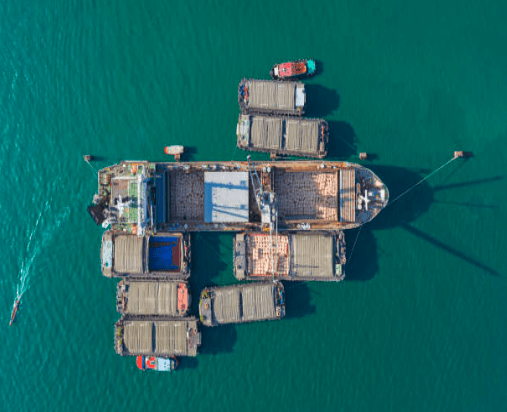 Barges at sea together in a group