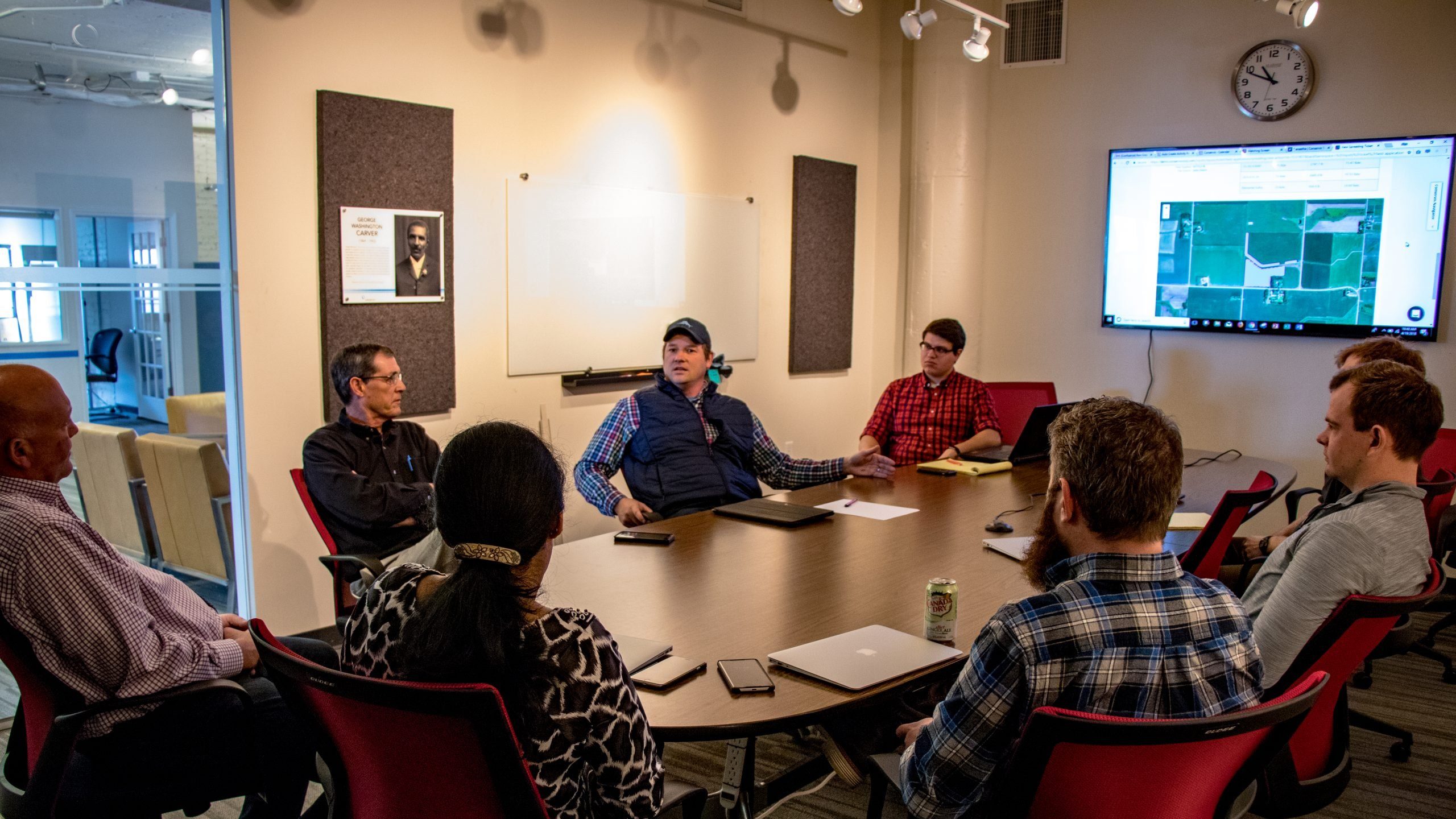 Employees sitting around a table in a conference room